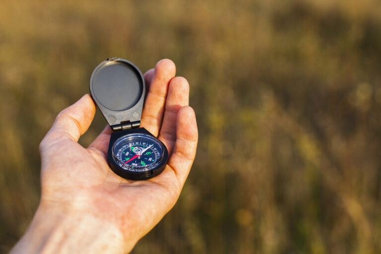 2026 10 23 high angle hand holding compass